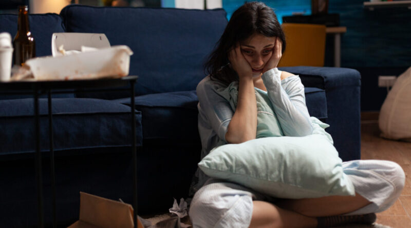 lonely traumatised frustrated ill woman holding head hands feeling vulnerable scaled e1678742189397